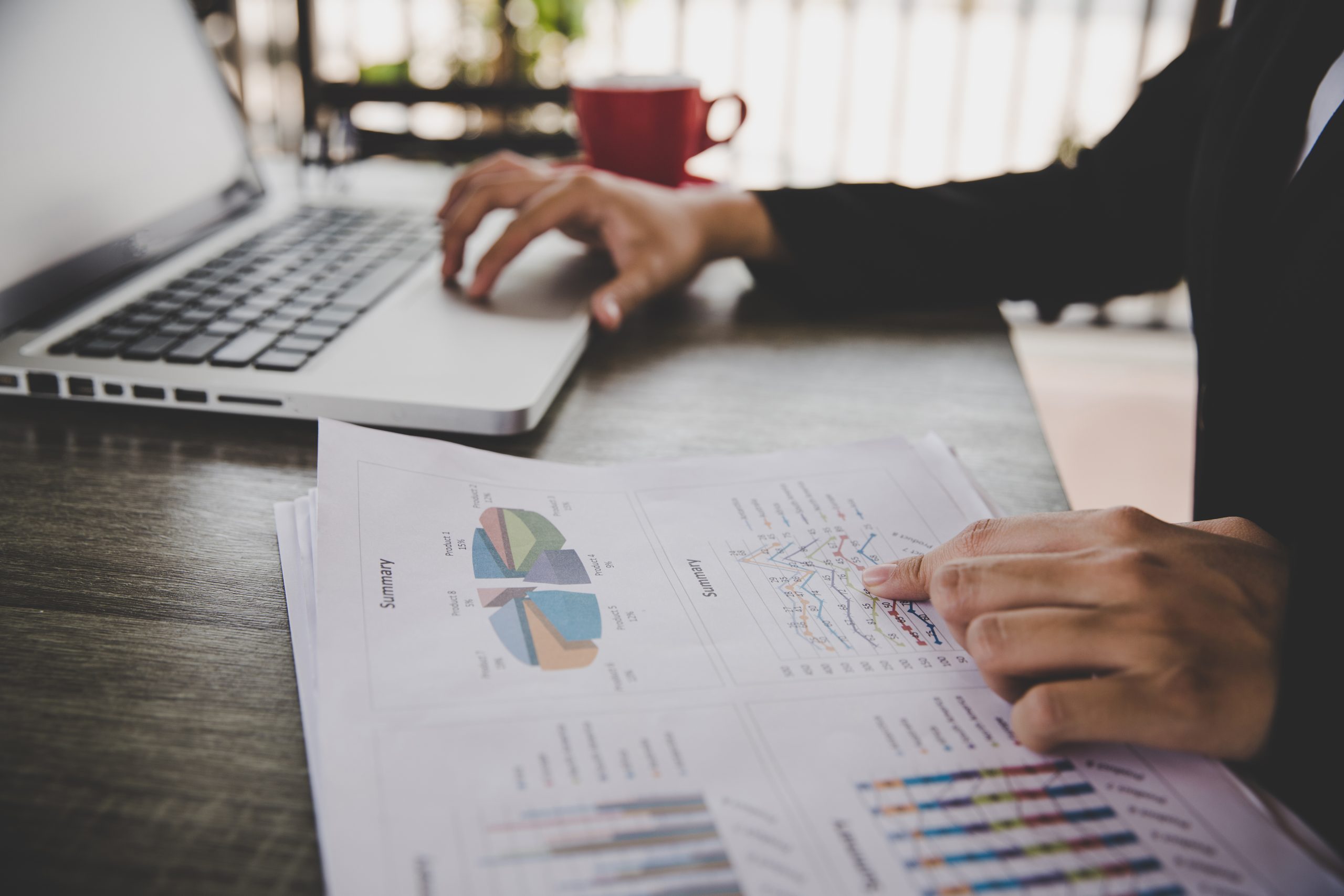 Businesswoman sitting in desk and work with financial documents